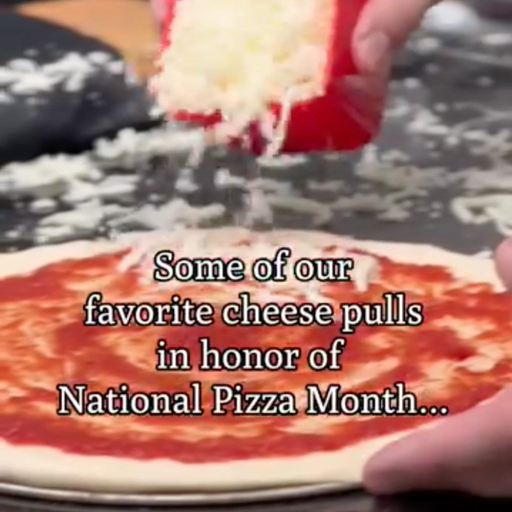 video still with caption: some of our favorite cheese pulls in honor of National Pizza Month